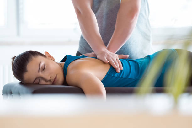 Patient receiving back adjustment treatment